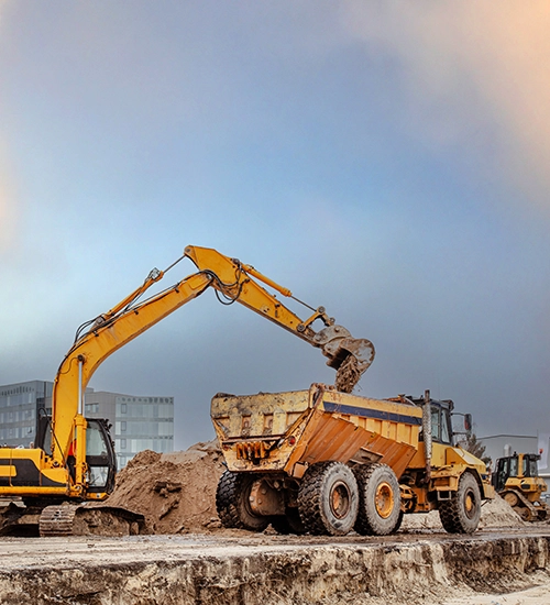 Construction equipment working at new building site. Pace Services for Government. Government, Environmental testing, Environmental lab.